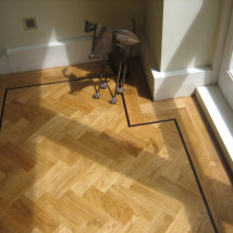 Oak Herringbone with a Wendge Border